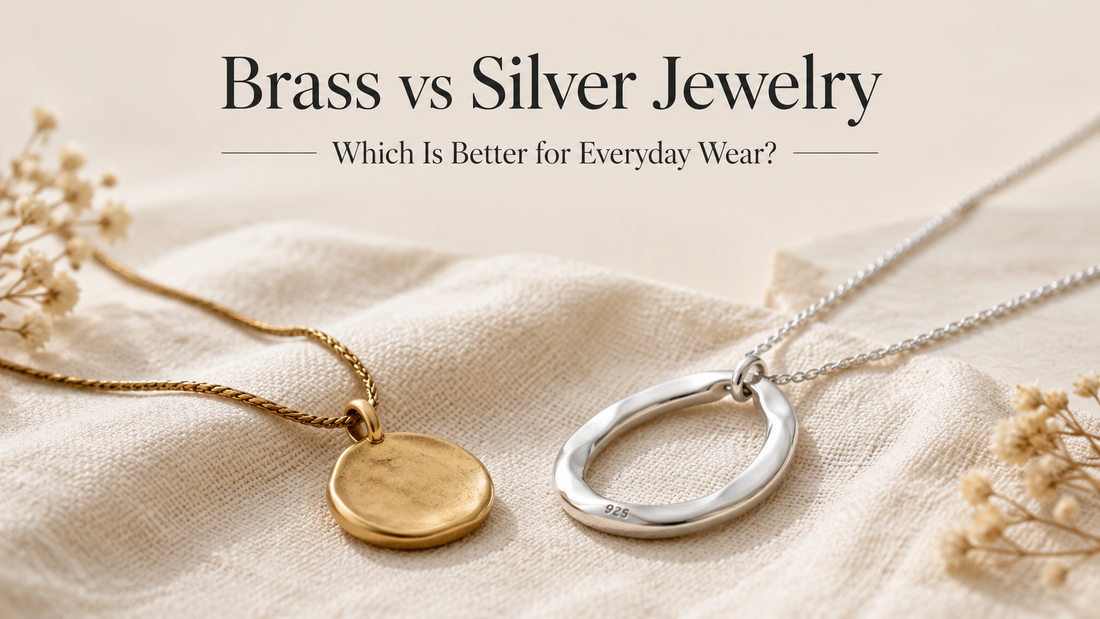 Editorial comparison of brass jewelry and sterling silver 925 jewelry on a neutral linen background, illustrating the differences between brass and silver for everyday wear.
