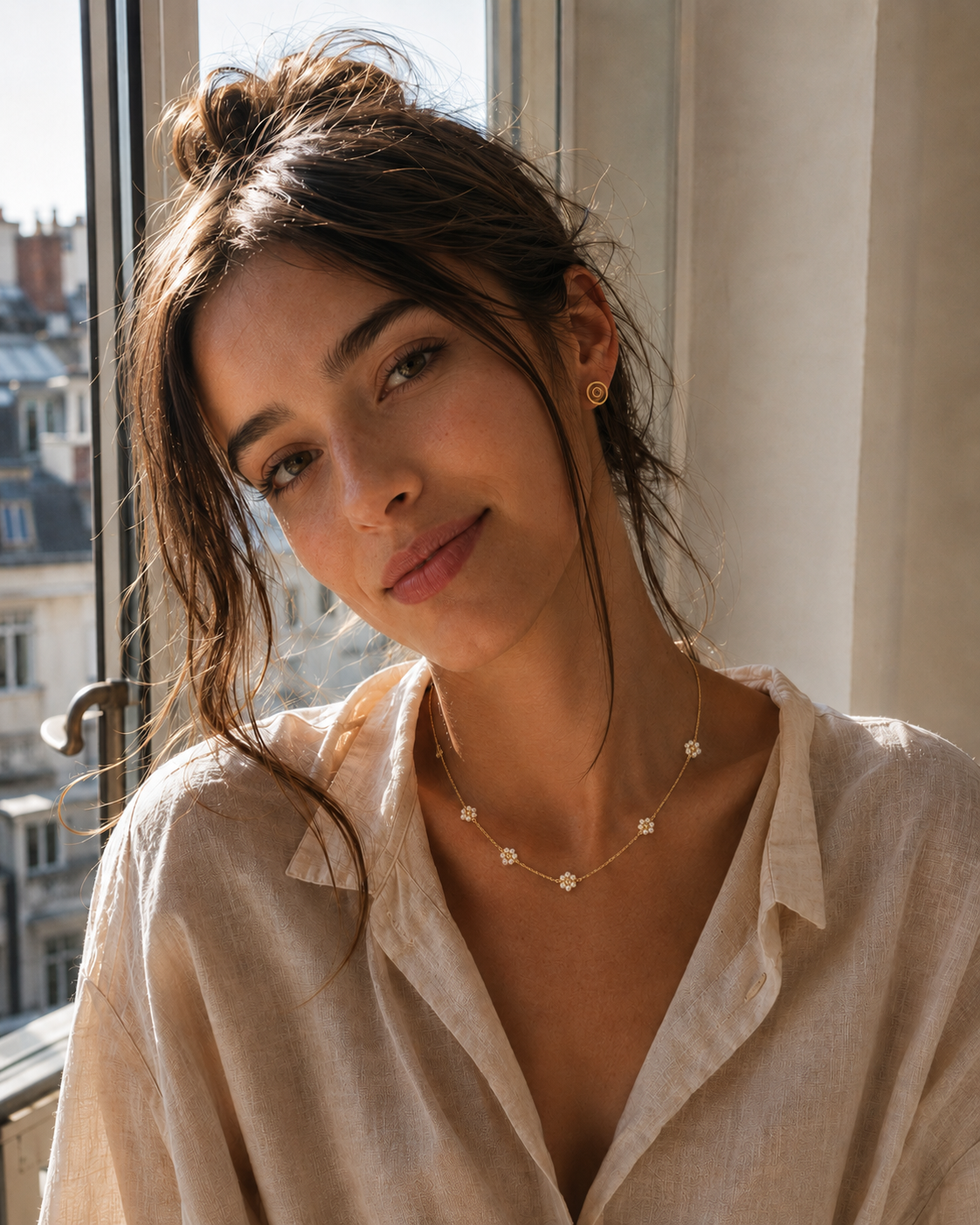 Woman wearing a delicate floral necklace in a romantic everyday jewelry look in Paris