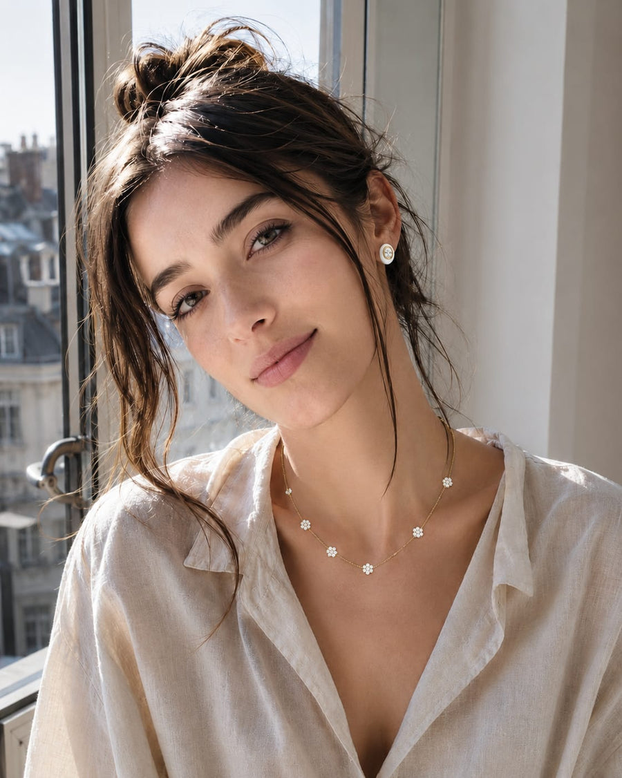 Minimalist_Parisian_woman_wearing_stainless_steel_necklace_and_hoop_earrings_everyday_jewelry_lifestyle