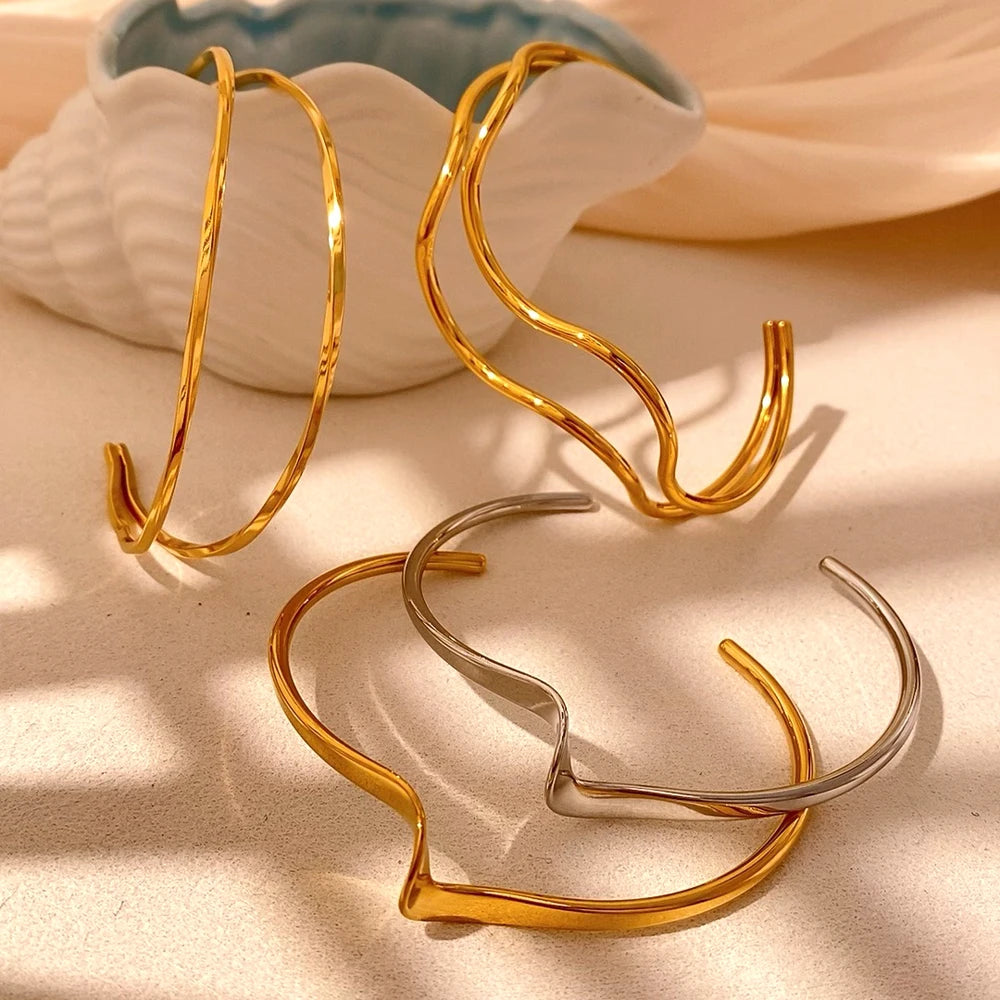 Gold plated or silver tone bracelet with polished finish