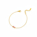 Gold-tone bracelet with colored stone detail