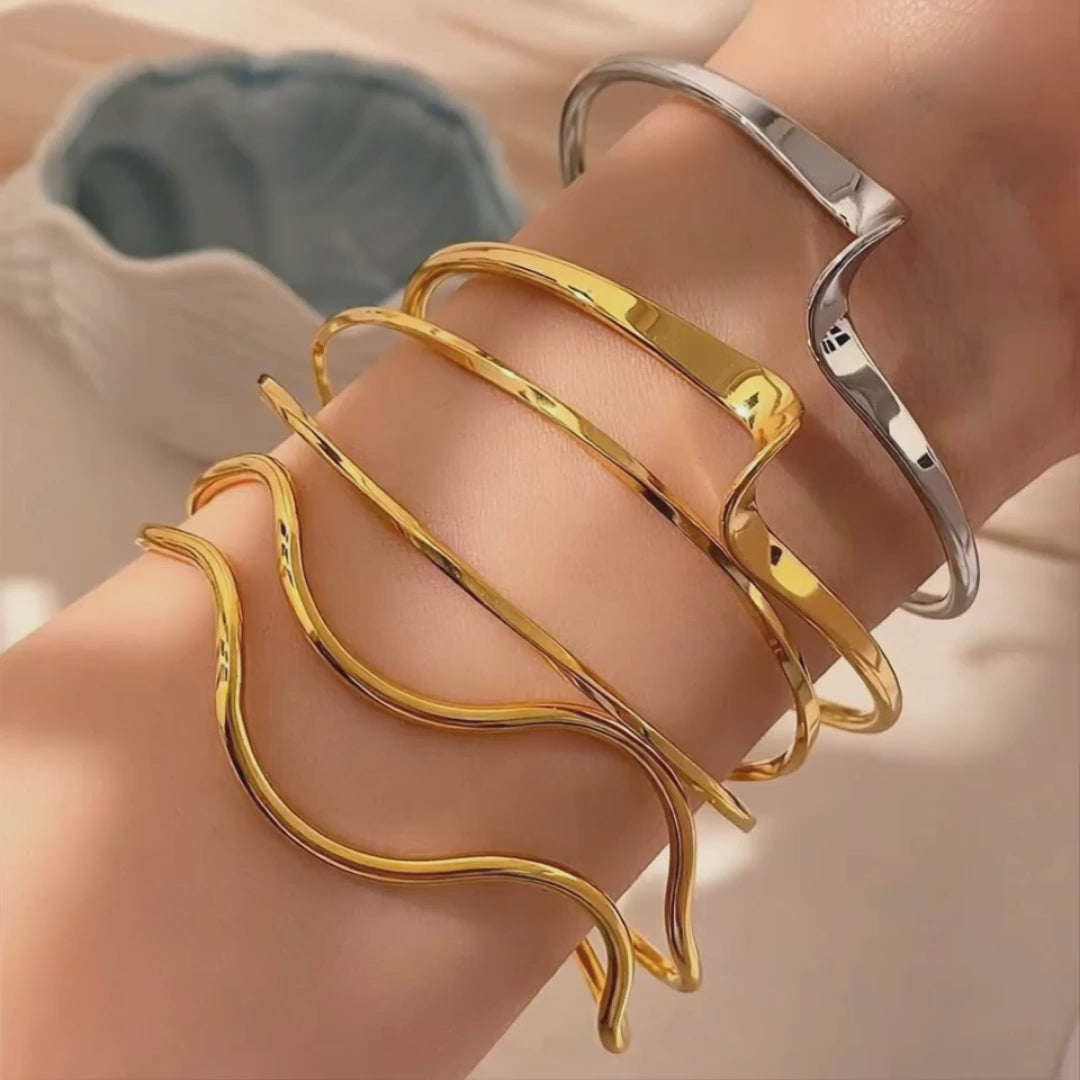 Gold plated or silver tone bracelet with polished finish
