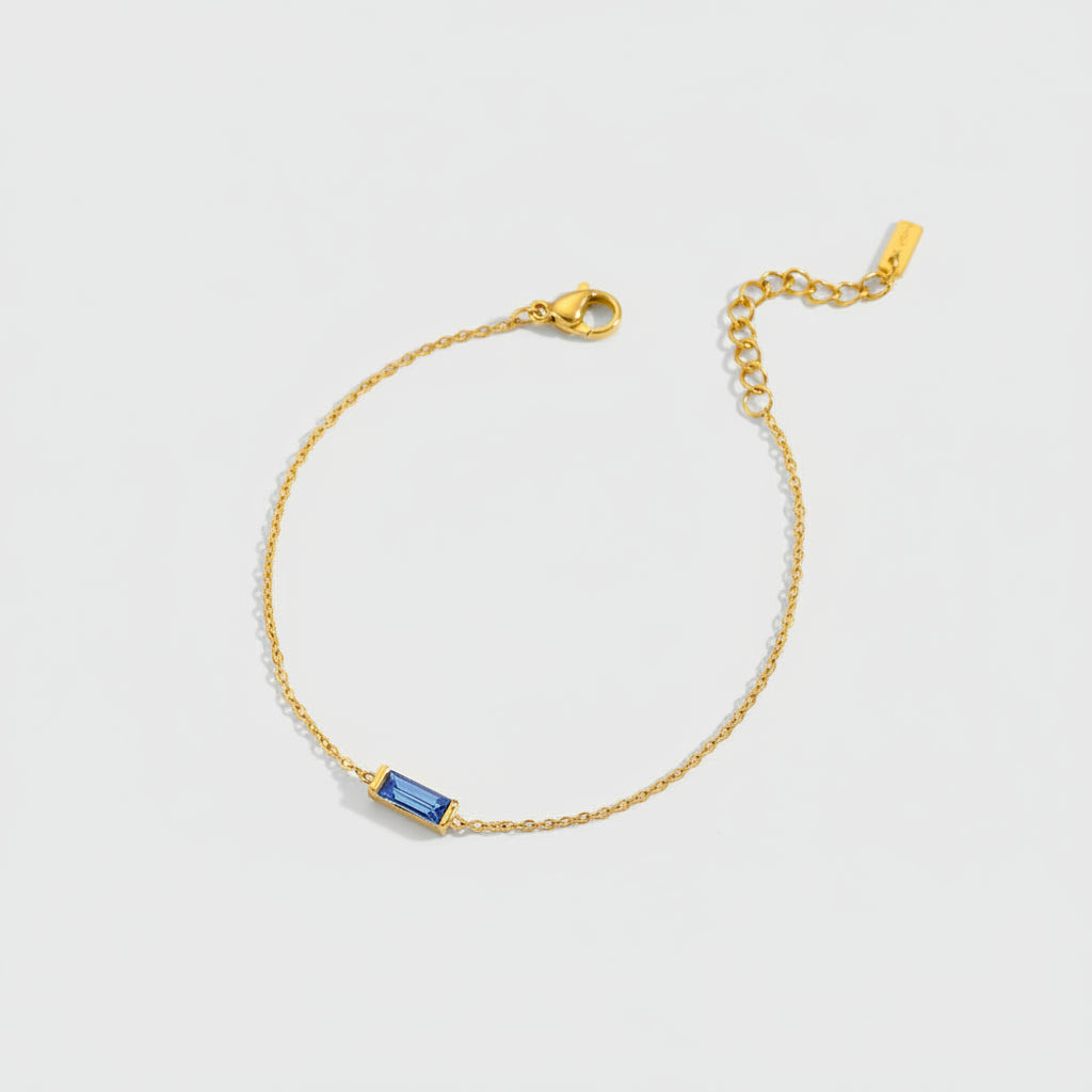 Gold-tone bracelet with colored stone detail